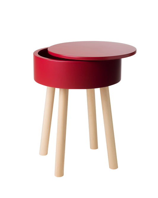 Multifunctional Piilo stool in Pomegranate Red. Piilo is a stool with storage space hidden inside its seat. Designed by Hanna Lantto. Made in Finland.